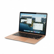 Gadgetdepop 2020 13-inch MacBook Air in gold with Retina display and macOS interface, angled view.